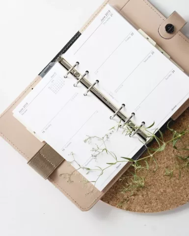 white and browm notebook